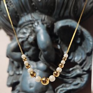 Elegant Gold and White Beaded Necklace